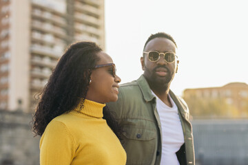 stylish afro american man and woman portrait with sunglasses