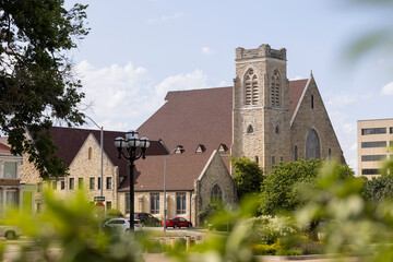 View of a historic church and buildings in downtown Topeka, Kansas, USA.
