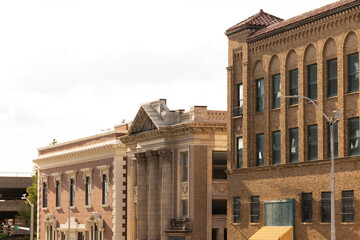 Fototapeta na wymiar Topeka, Kansas, USA - June 17, 2023: Afternoon light shines on historic buildings in downtown Topeka.