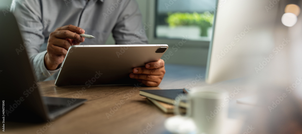 Poster businessman work use reading and hand holding digital tablet technology screen connecting wifi read 