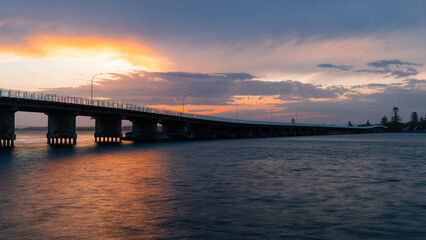 Fototapeta na wymiar Sunset view of Forster-Tuncurry Bridge, NSW, Australia.