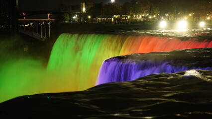 The beautiful Niagara waterfall landscape with the colorful lights on at night