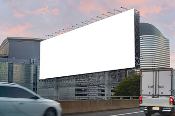 Large horizontal blank sign on a highway in Bangkok, Thailand. Traffic and sky. Blank billboard at twilight for advertisement.