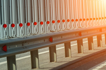 Safety barriers on highway. Anodized safety steel barrier. Enhancing highway safety.