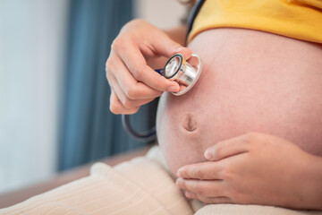 pregnant woman Listen to your baby's voice with stethoscope