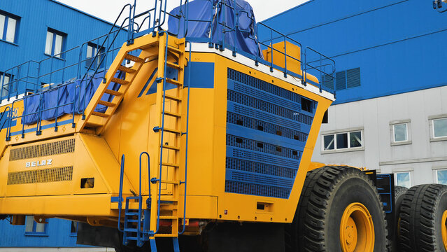 New dump truck without a body on the territory of the plant. BelAZ 75710 is the largest dump truck in the world. Only 4 trucks were produced. Huge yellow lorry. Zhodino, Belarus April 22, 2023