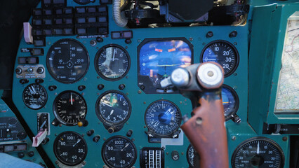 Inside the cabin of the Mi-24 military transport helicopter. Close-up of the control panel,...