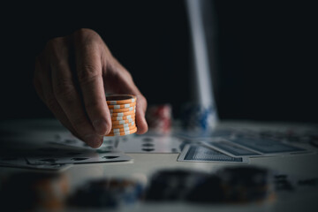 Takes a bet on all chips. poker is a game of chance.poker in a casino at a green table. - obrazy, fototapety, plakaty