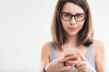 Gray top, absorbed in smartphone content