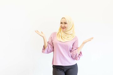 Cheerful Asian Muslim woman doing various poses in the free space and white background