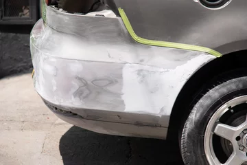 Deurstickers Car bumper repair © Félix Andrés