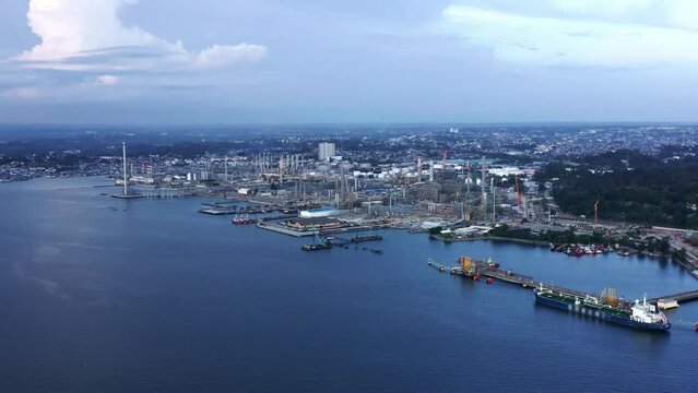 Expansion Landscape Of Industrial Area At Port of Balikpapan City With Pertamina Oil Refinery In Indonesia. Aerial Shot