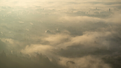 Bergamo, Italy. Amazing landscape of the town covered by the fog arising from the plain. Fall season. Morning. Sunrise time