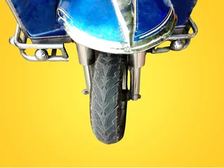 Poster Headlight​ of motor​ tricycle auto vehicle​ in Bangkok Thailand on yellow background. © angei535