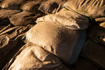 Aged sandbags on the ground