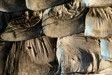 Aged sandbags on the ground