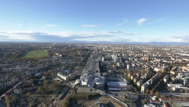 Milan city and Alps in horizon with Mi.Co bellow, aerial panoramic view