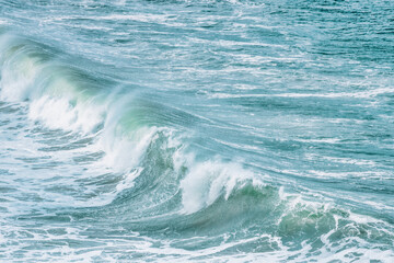 Wave splashing close-up. Crystal clear sea water, in the ocean in San Francisco Bay, blue water,...