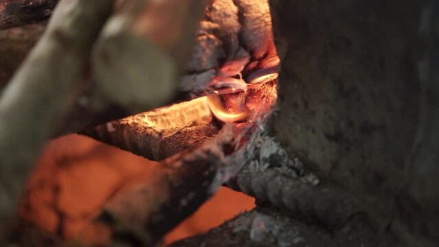 the appearance of wood being consumed by fire and becoming charcoal