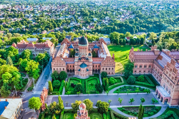 Aerial view of Yuriy Fedkovych National University, Seminar Residence and Church of the Three Hierarchs. Old historical university building with towers, domes and green garden Chernivtsi, Ukraine