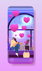 girl in love using laptop social media communication happy valentines day celebration concept living room interior with pink hearts
