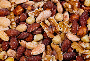 A close-up with a mix of many types of dried nuts