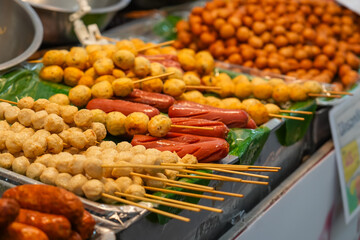 Fried food sausages and meat balls with sticks Thai style food, Thailand street food Bangkok.