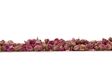 Dry tea roses isolated on white background.