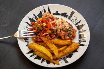 plate of salmon with fries