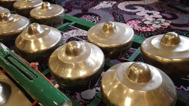 Javanese Gamelan Musical Instruments Bells and Bronze Gongs of Indonesia Closeup