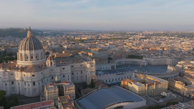 Aerial footage in the sunset slowly rotating around St. Peters Basilica in Rome, Italy.