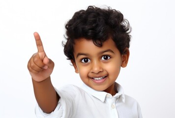 Young Boy Smiling and Holding Up His Finger