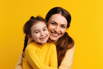 A mother and daughter bonding and smiling together for a picture