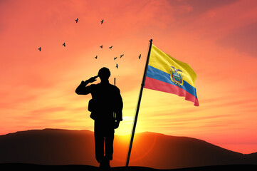 Silhouette of a soldier with the Ecuador flag stands against the background of a sunset or sunrise. Concept of national holidays. Commemoration Day.