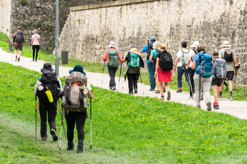Couples and group Doing the Way of St. James. Walls of Pamplona, ​​Navarra
