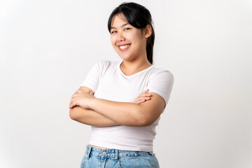 the pretty and happy Asian young woman is smiling confidently standing on a white background.