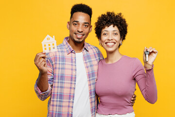 Young couple two friends family man woman of African American ethnicity wear purple casual clothes...