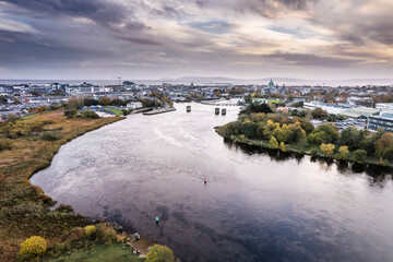 Aerial view on River Corrib and Galway city, Ireland. Warm sunny day with stunning dramatic cloudy...