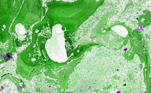 Abstract background. Green and white colors. Blue drops. Marble. Chaotic spots and drops. Different shades and blurs.