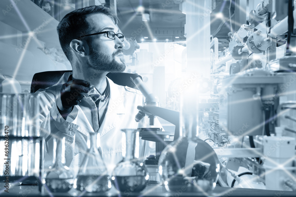 Poster man biologist in laboratory. scientist at table with test tubes. biologist uses microscope. speciali