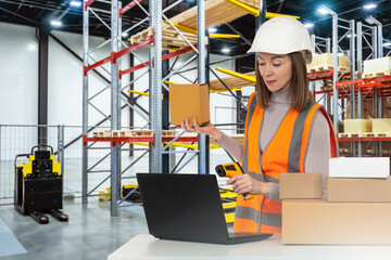 Woman works in customs warehouse. Girl with barcode scanner. Manager in warehouse building. Specialist scans code on box. Storeman uses terminal and computer. Woman storage worker in orange vest - obrazy, fototapety, plakaty