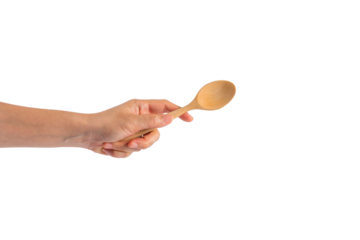 Wooden spoon in hand on transparent background.