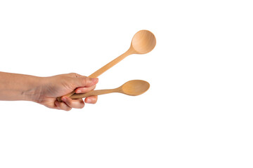 Two wooden spoon in hand on transparent background.