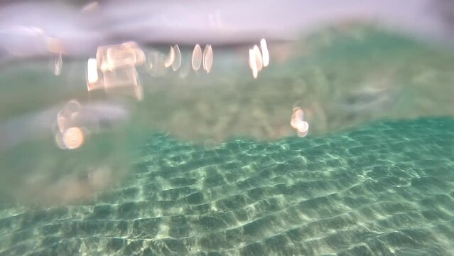 Underwater view of the seabed of the beautiful Falassarna beach, Crete, Greece. Quiet day of relaxation and inner peace. Turquoise colored, transparent water.