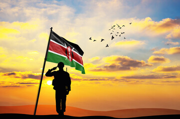 Silhouette of a soldier with the Kenya flag stands against the background of a sunset or sunrise. Concept of national holidays. Commemoration Day. ©  minionionniloy