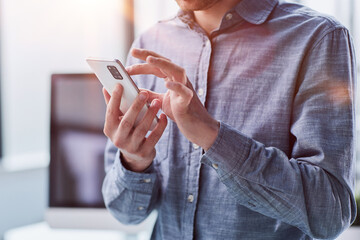 close up.a businessman uses a smartphone. people and technology