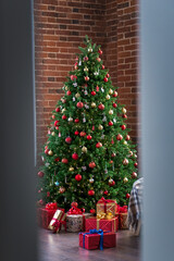 Happy New Year and Christmas! New Year's interior in loft style, green Christmas tree and classic decorations.