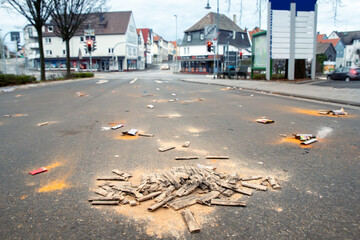 Fireworks rocket launcher box trash remains on german city street after Silvester party traditional celebration. Spoiled firecrackers waste rubbish european Germany town sidewalk Christmas New year