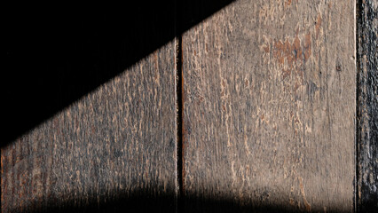  Light and shadow on the brown wooden board.Old brown wooden board, wooden texture dark brown and background.