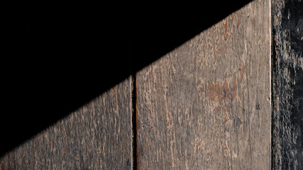  Light and shadow on the brown wooden board.Old brown wooden board, wooden texture dark brown and background.